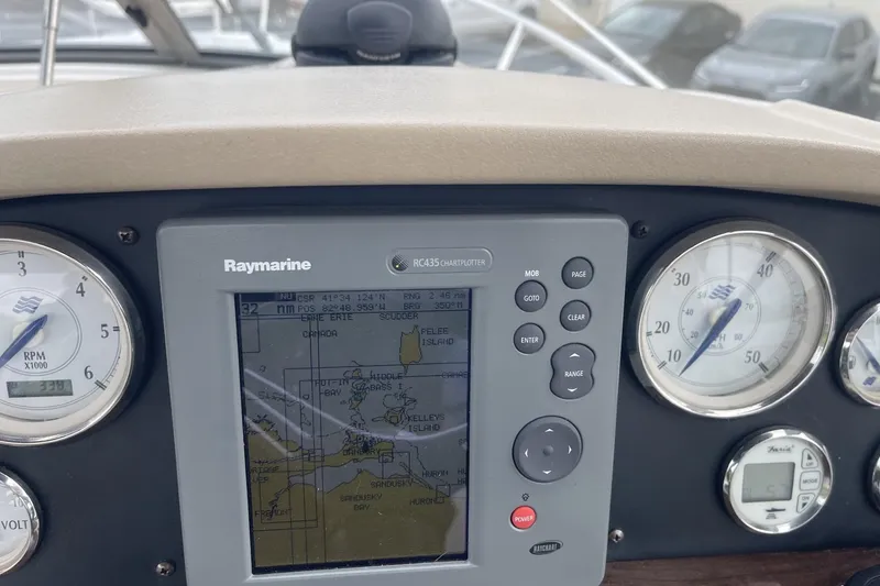 Slide: The Image of Dashboard of a 2009 Four Winns V258 boat with Raymarine chartplotter and gauges. - 22