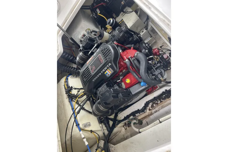 Slide: The Image of 2009 Four Winns V258 boat engine compartment with Volvo Penta engine. - 43