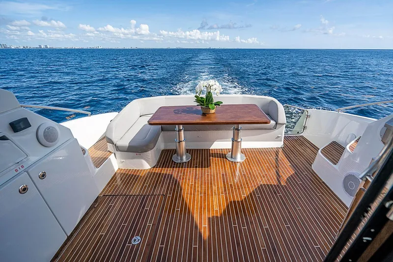 Slide: The Image of 2017 Beneteau GRAN TURISMO yacht deck with seating, table, and ocean view. - 10