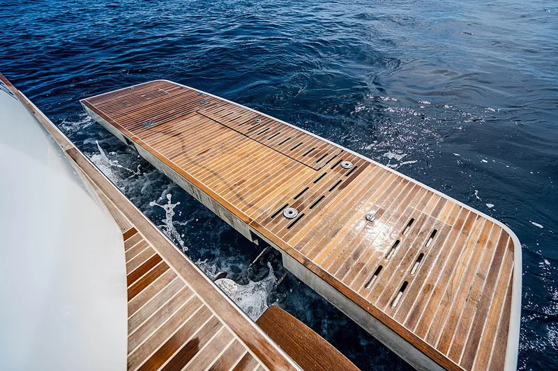 Slide: The Image of Beneteau Gran Turismo 2017 yacht with wooden swim platform on open water. - 16