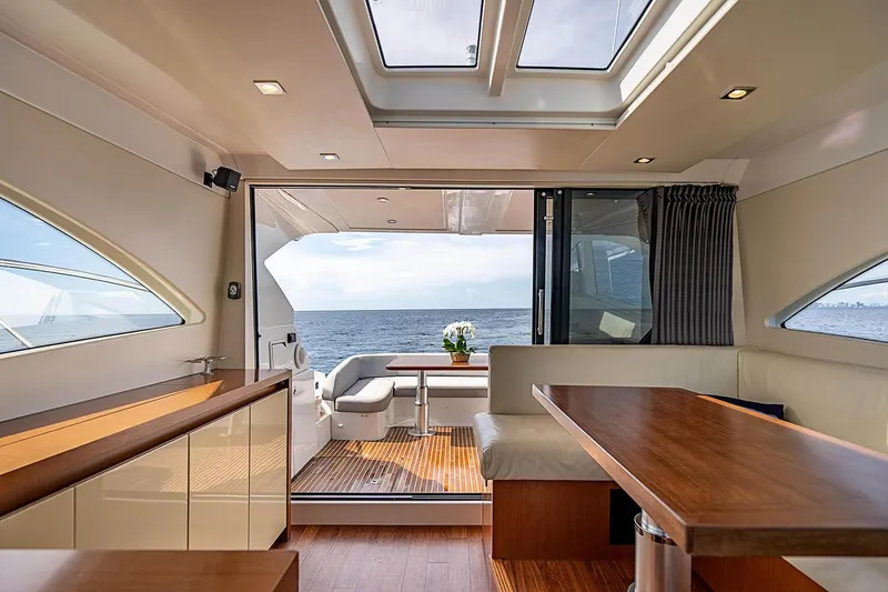 Slide: The Image of Luxurious interior of 2017 Beneteau Gran Turismo yacht with ocean view and elegant seating area. - 22