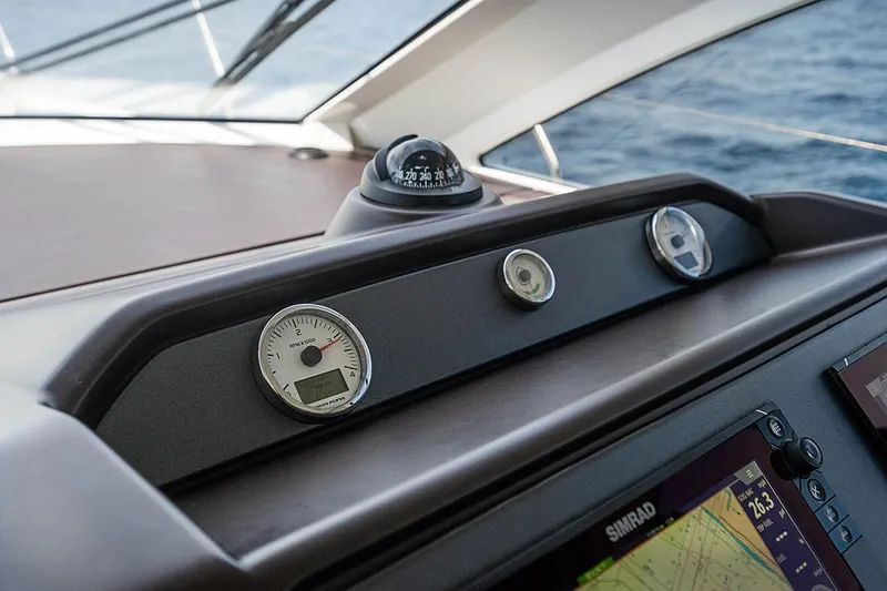 Slide: The Image of Helm of 2017 Beneteau Gran Turismo yacht with compass and gauges. - 32