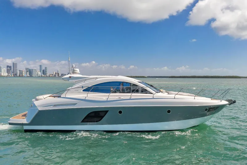 Slide: The Image of 2017 Beneteau GRAN TURISMO yacht cruising on clear blue water under a sunny sky. - 7
