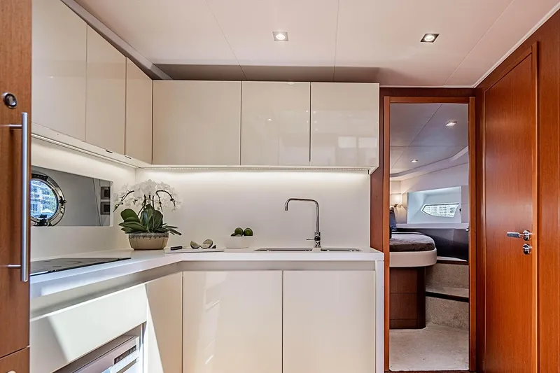 Slide: The Image of Luxurious kitchen interior of 2017 Beneteau Gran Turismo yacht with modern cabinetry and sleek design. - 8