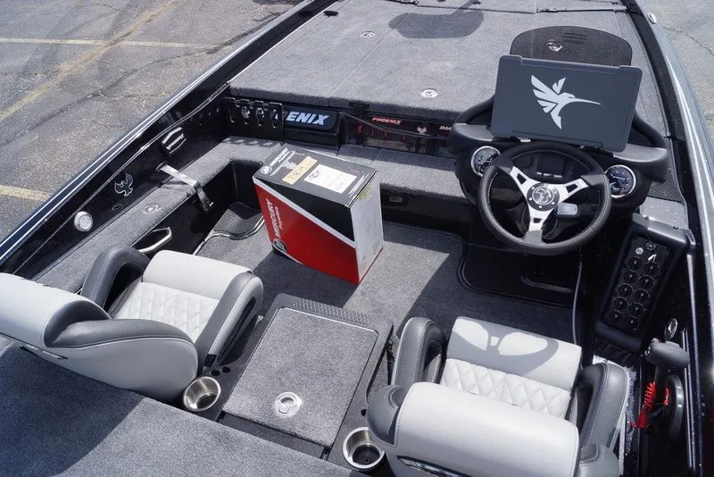 Slide: The Image of Interior of 2026 Phoenix 721 ZXL boat with steering wheel and seating. - 13