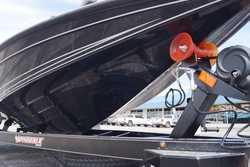 Slide: The Image of Close-up of a 2026 Phoenix 721 ZXL boat hull on a trailer. - 16