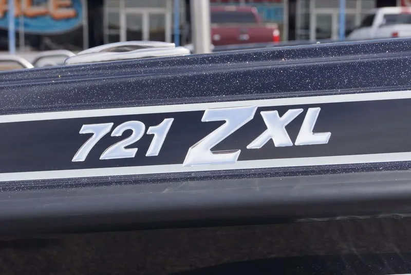Slide: The Image of 2026 Phoenix 721 ZXL boat model emblem on a sleek, dark surface. - 5