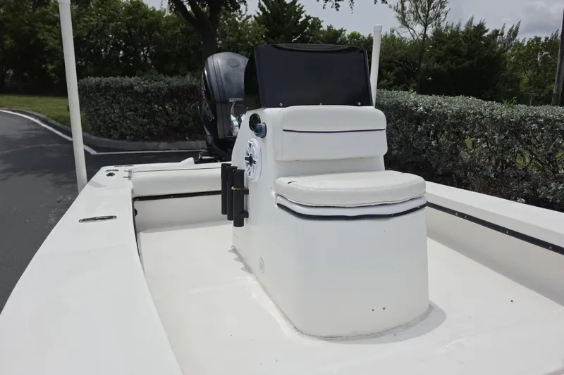 Slide: The Image of 2016 Aqua Dyne 17 boat with white seating and console, parked outdoors. - 10