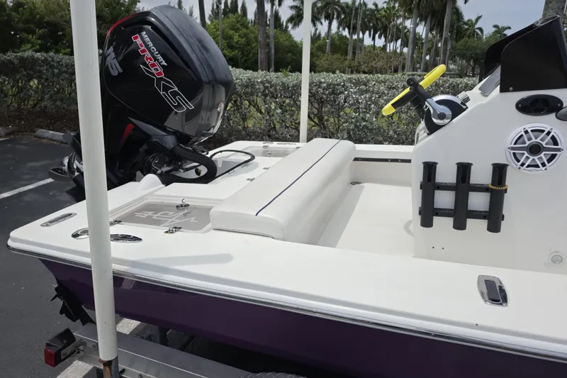 Slide: The Image of Aqua Dyne 17 boat, 2016 model, with Mercury Pro XS engine, parked outdoors. - 12