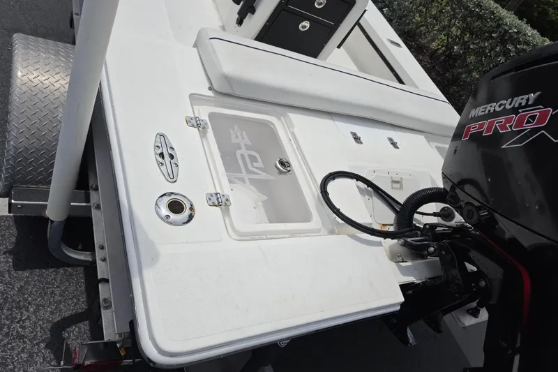 Slide: The Image of 2016 Aqua Dyne 17 boat with Mercury Pro engine, featuring a clean deck layout. - 18