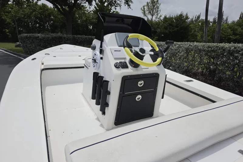 Slide: The Image of 2016 Aqua Dyne 17 boat with yellow steering wheel, console, and storage drawers. - 6