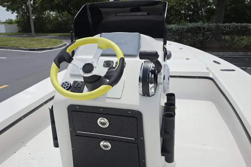 Slide: The Image of 2016 Aqua Dyne 17 boat console with yellow steering wheel and control panel. - 7