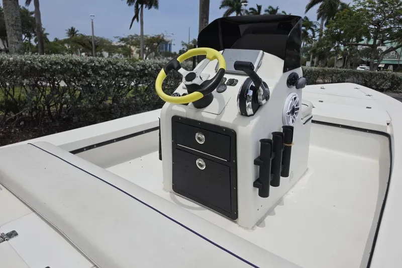 Slide: The Image of Center console of a 2016 Aqua Dyne 17 boat with steering wheel and controls. - 8