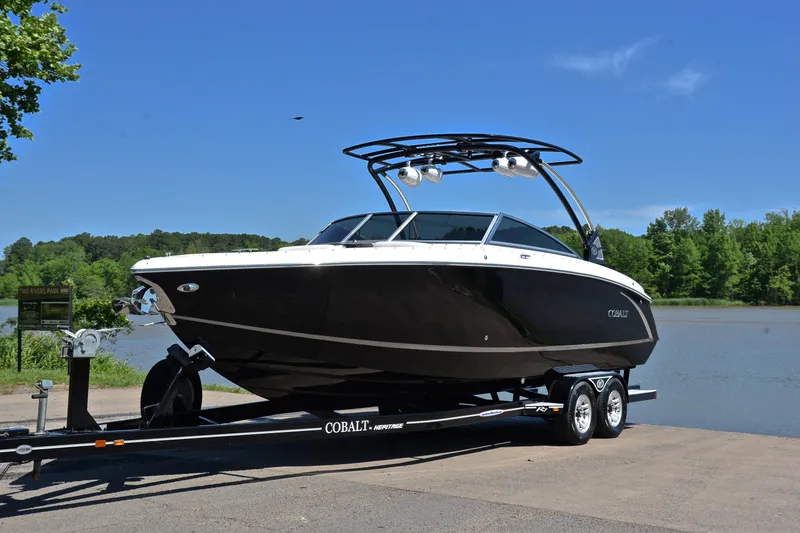 Slide: The Image of 2018 Cobalt R7 boat on trailer by a scenic lake. - 11
