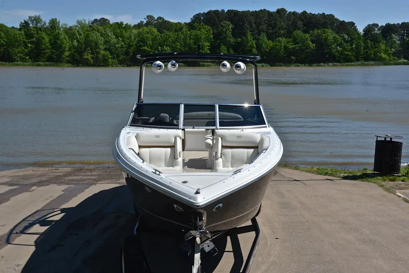 Slide: The Image of 2018 Cobalt R7 boat on trailer by a scenic lake. - 18