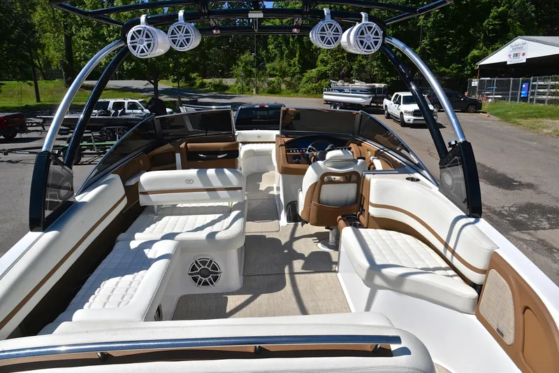 Slide: The Image of Luxurious 2018 Cobalt R7 boat interior with white seating and modern audio system. - 19