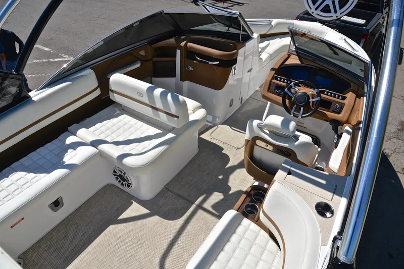 Slide: The Image of Luxurious interior of a 2018 Cobalt R7 boat with white and brown seating. - 20