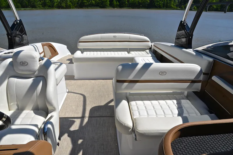 Slide: The Image of Luxurious interior of a 2018 Cobalt R7 boat with white seating and lake view. - 23