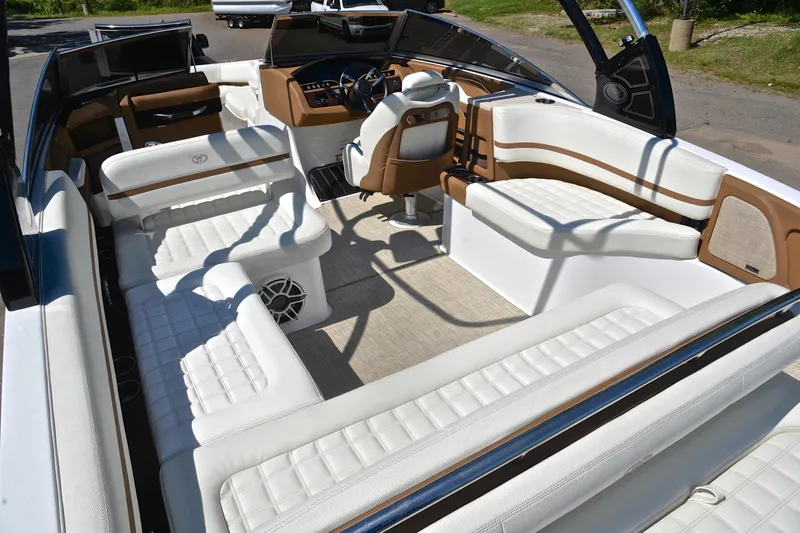 Slide: The Image of Luxurious interior of a 2018 Cobalt R7 boat with white and tan seating. - 25