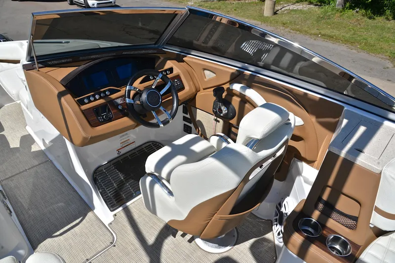 Slide: The Image of Interior of 2018 Cobalt R7 boat with steering wheel and control panel. - 26