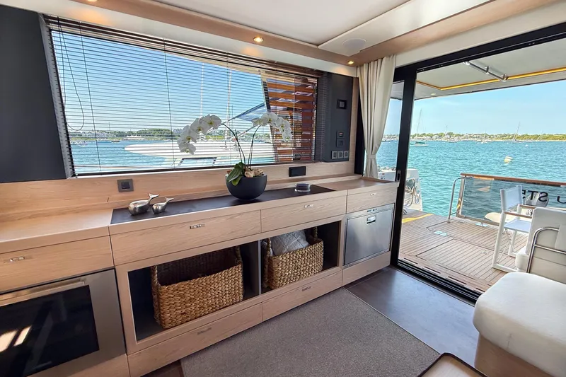Slide: The Image of Luxurious interior of 2026 Beneteau Swift Trawler 54 with ocean view and modern amenities. - 4
