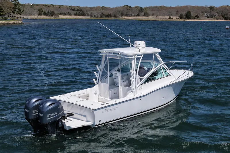 Slide: The Image of 2018 Albemarle 25 Express boat with twin Yamaha engines on open water. - 12
