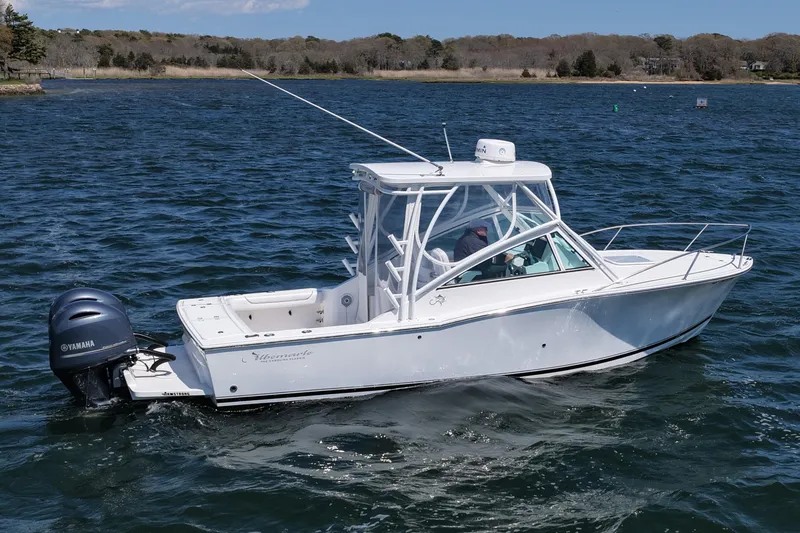 Slide: The Image of 2018 Albemarle 25 Express boat on water, featuring Yamaha outboard motor. - 13