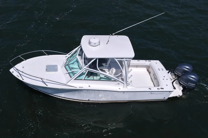Slide: The Image of 2018 Albemarle 25 Express boat on water, featuring twin Yamaha engines. - 15