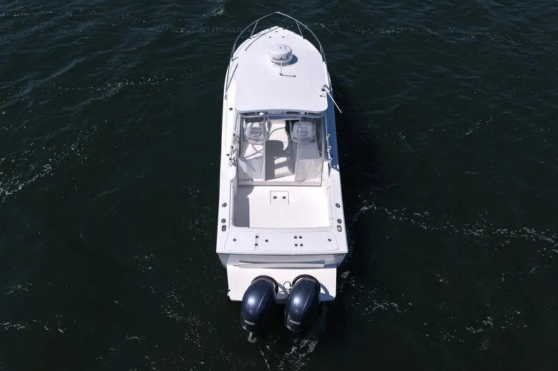Slide: The Image of 2018 Albemarle 25 Express boat with dual engines on open water. - 16