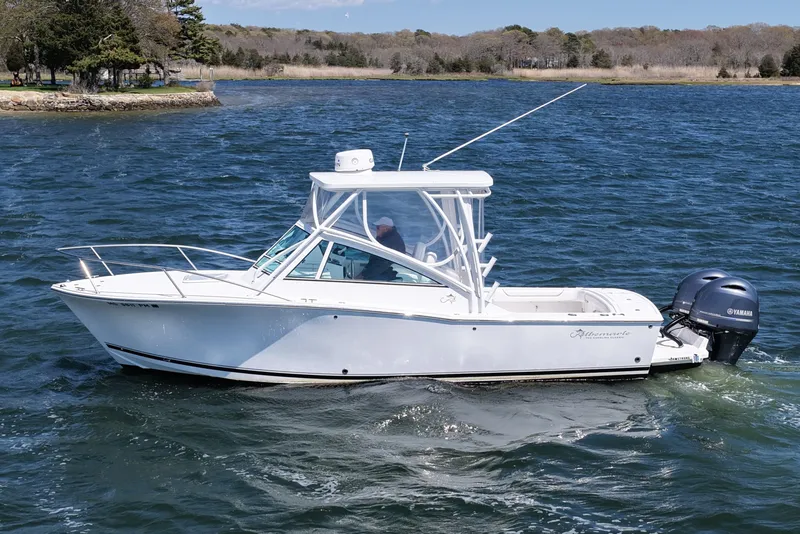 Slide: The Image of 2018 Albemarle 25 Express boat cruising on a scenic lake with Yamaha outboard. - 7