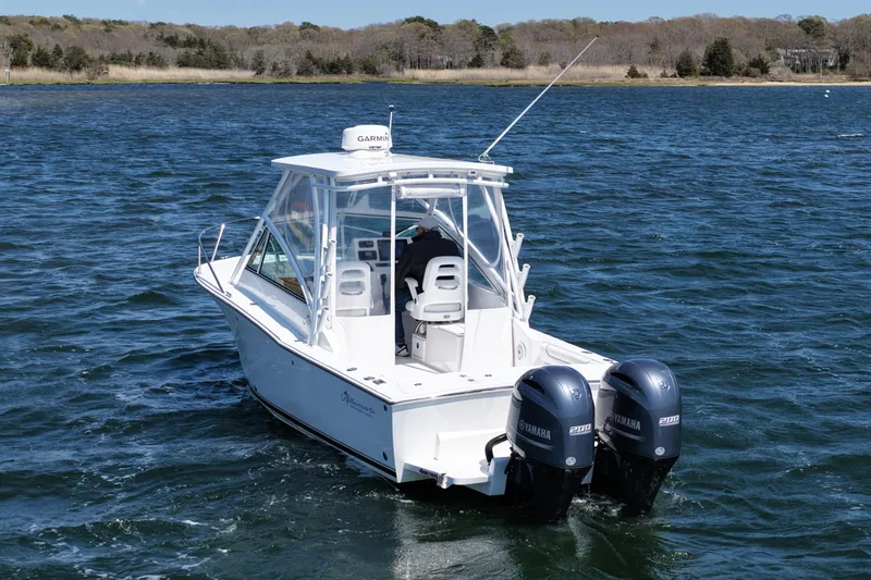 Slide: The Image of 2018 Albemarle 25 Express boat with dual Yamaha engines on open water. - 9