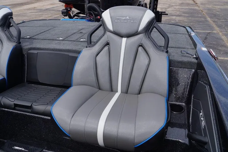 Slide: The Image of Skeeter ZXE21 2026 boat seat with gray upholstery and blue accents. - 19