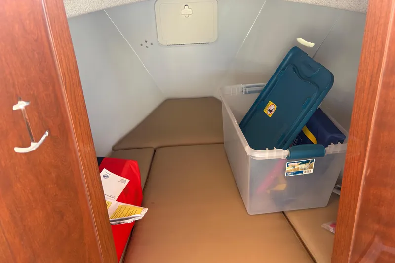 Slide: The Image of 2019 Duffy Cuddy Cabin 22 interior with storage box and documents. - 11