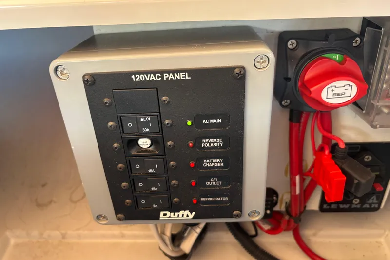 Slide: The Image of Electrical panel of 2019 Duffy Cuddy Cabin 22 boat with switches and indicators. - 15