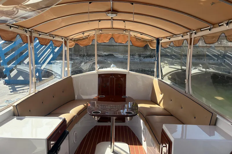 Slide: The Image of Interior of 2019 Duffy Cuddy Cabin 22 boat with seating and table. - 8