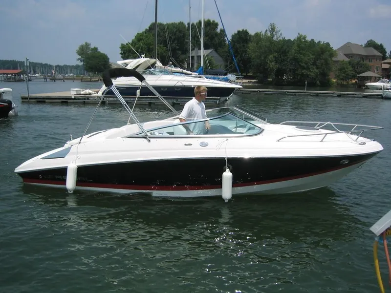 The Image of 2008 Regal 2250 Cuddy boat on a calm lake. - 0