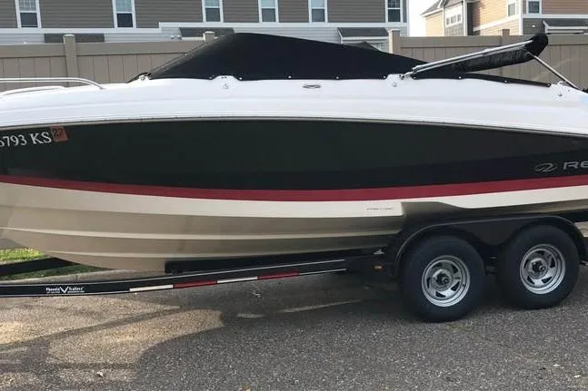 Slide: The Image of 2008 Regal 2250 Cuddy boat on trailer, parked outdoors. - 13