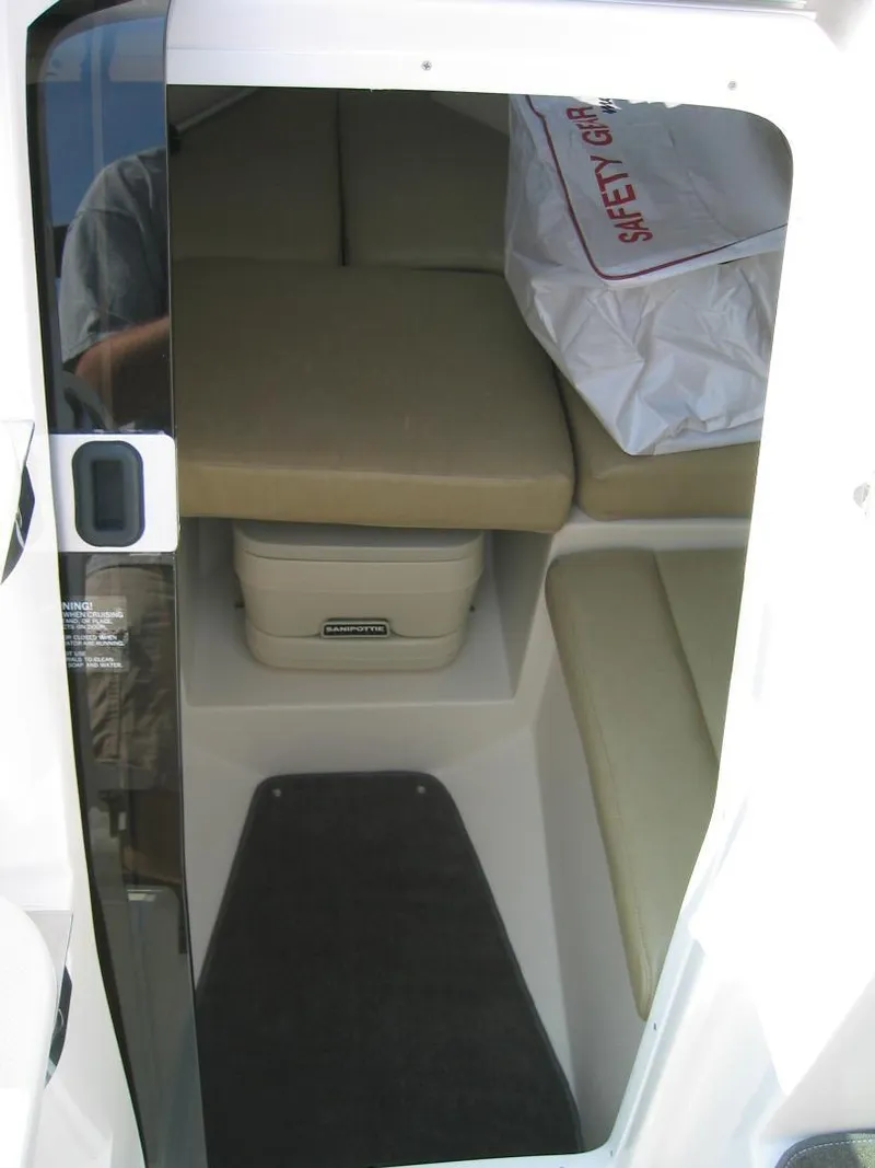Slide: The Image of Interior of 2008 Regal 2250 Cuddy boat with seating and storage. - 3