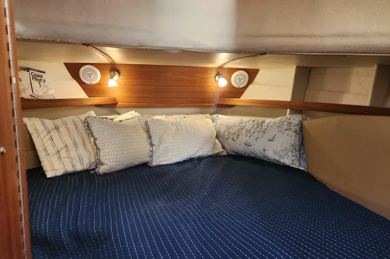 Slide: The Image of Cozy cabin interior of 2019 Ranger Tugs R-31 CB with pillows and reading lights. - 18