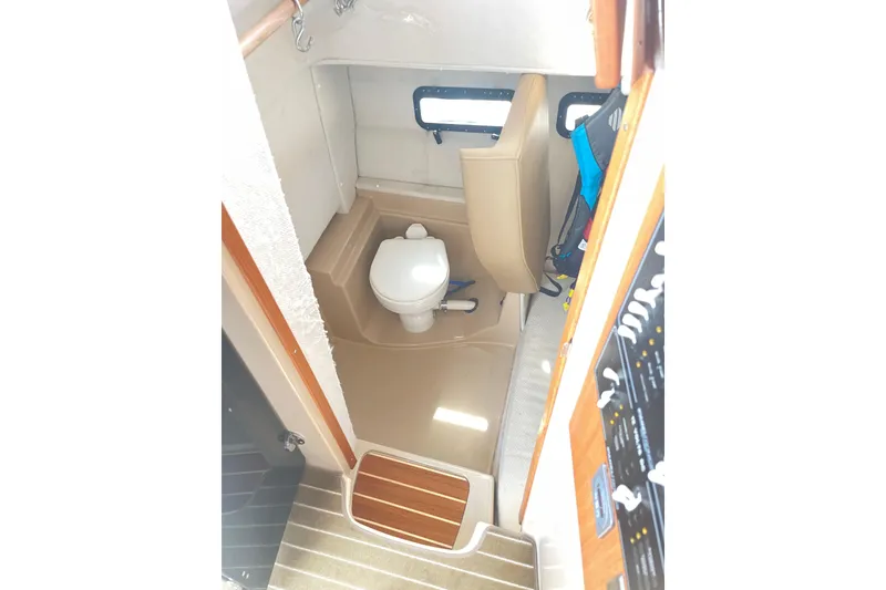 Slide: The Image of Interior of 2019 Ranger Tugs R-31 CB with toilet. - 26