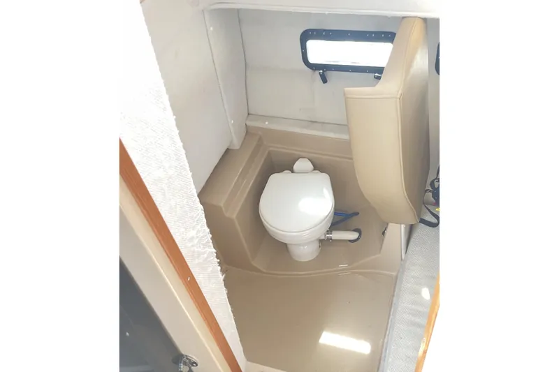 Slide: The Image of 2019 Ranger Tugs R-31 CB boat interior with compact marine toilet. - 28