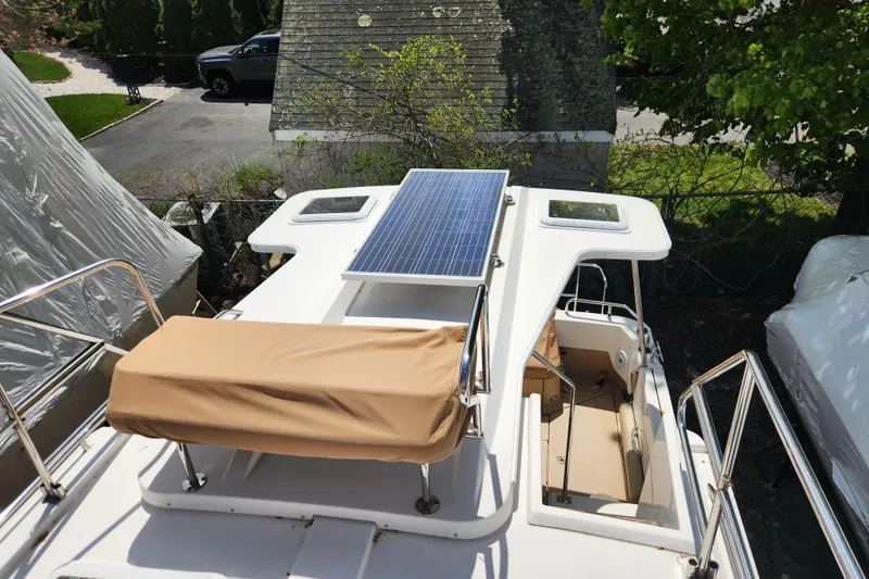 Slide: The Image of 2019 Ranger Tugs R-31 CB boat with solar panel on deck, docked outdoors. - 42