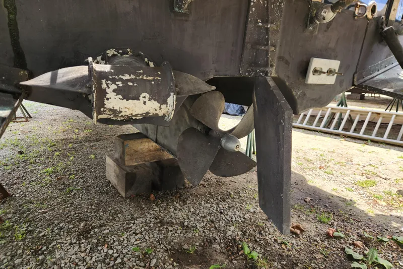 Slide: The Image of Propeller and rudder of 2019 Ranger Tugs R-31 CB on gravel surface. - 46