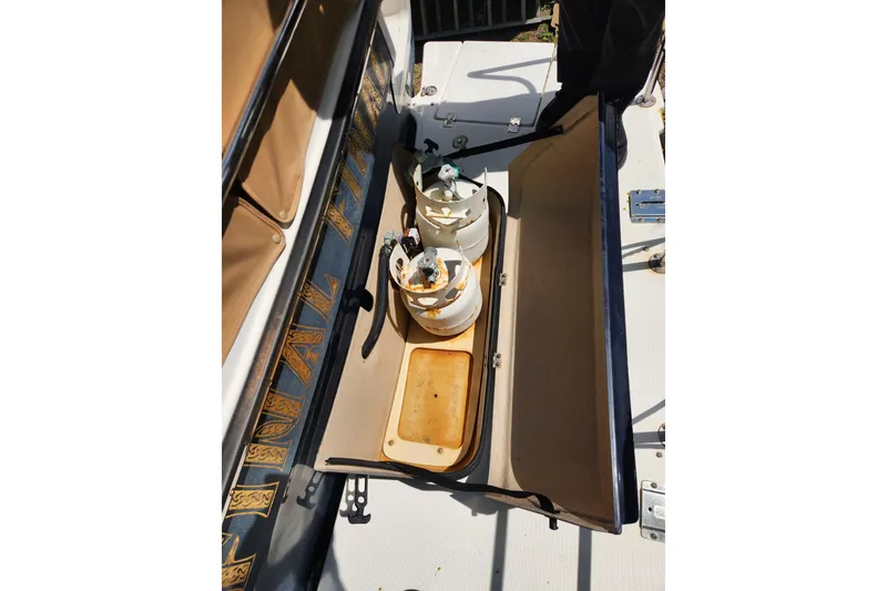 Slide: The Image of 2019 Ranger Tugs R-31 CB boat storage compartment with propane tanks. - 48