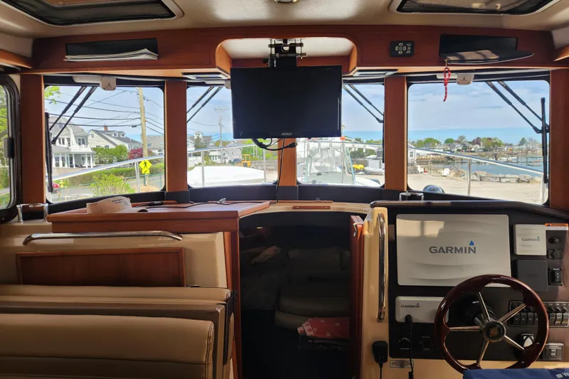 Slide: The Image of Interior view of 2019 Ranger Tugs R-31 CB boat with Garmin navigation system. - 9