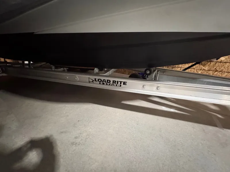 Slide: The Image of Apex A 24 boat on Load Rite trailer, 2025 model. - 10