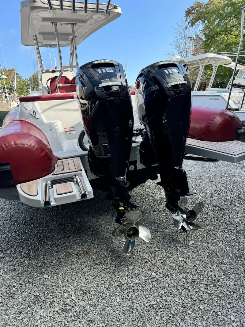 Slide: The Image of Apex A 24 boat 2025 with dual Mercury 115 outboard engines. - 4