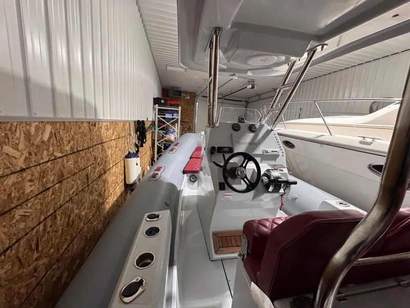 Slide: The Image of Interior of an Apex A 24 boat, 2025 model, in storage facility. - 8