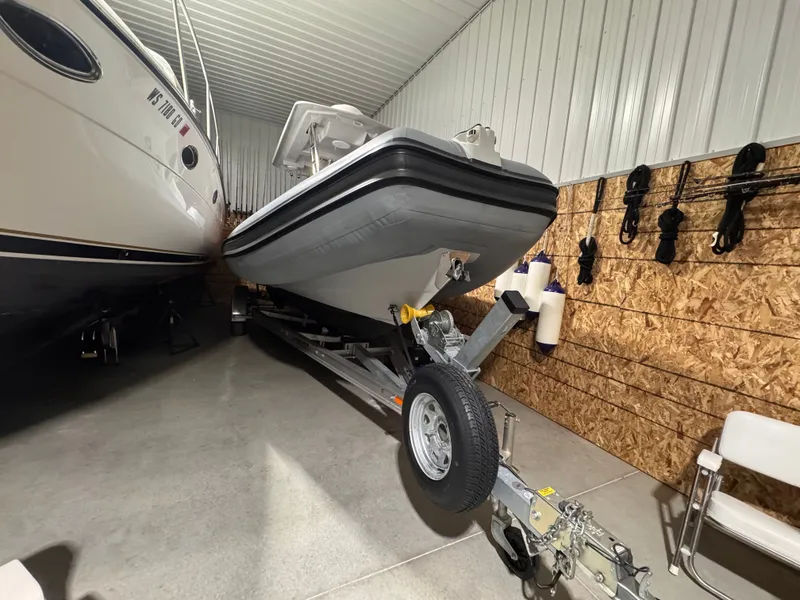 Slide: The Image of Apex A 24 boat from 2025 in a storage facility. - 9