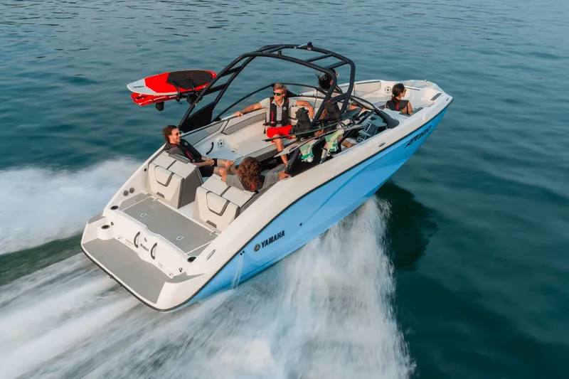 Slide: The Image of 2024 Yamaha AR220 boat on water with passengers. - 16
